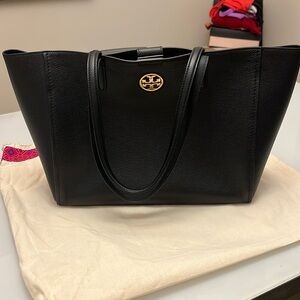 Tory Burch Carson Tote comes with dust bag. Some white marking on inside.